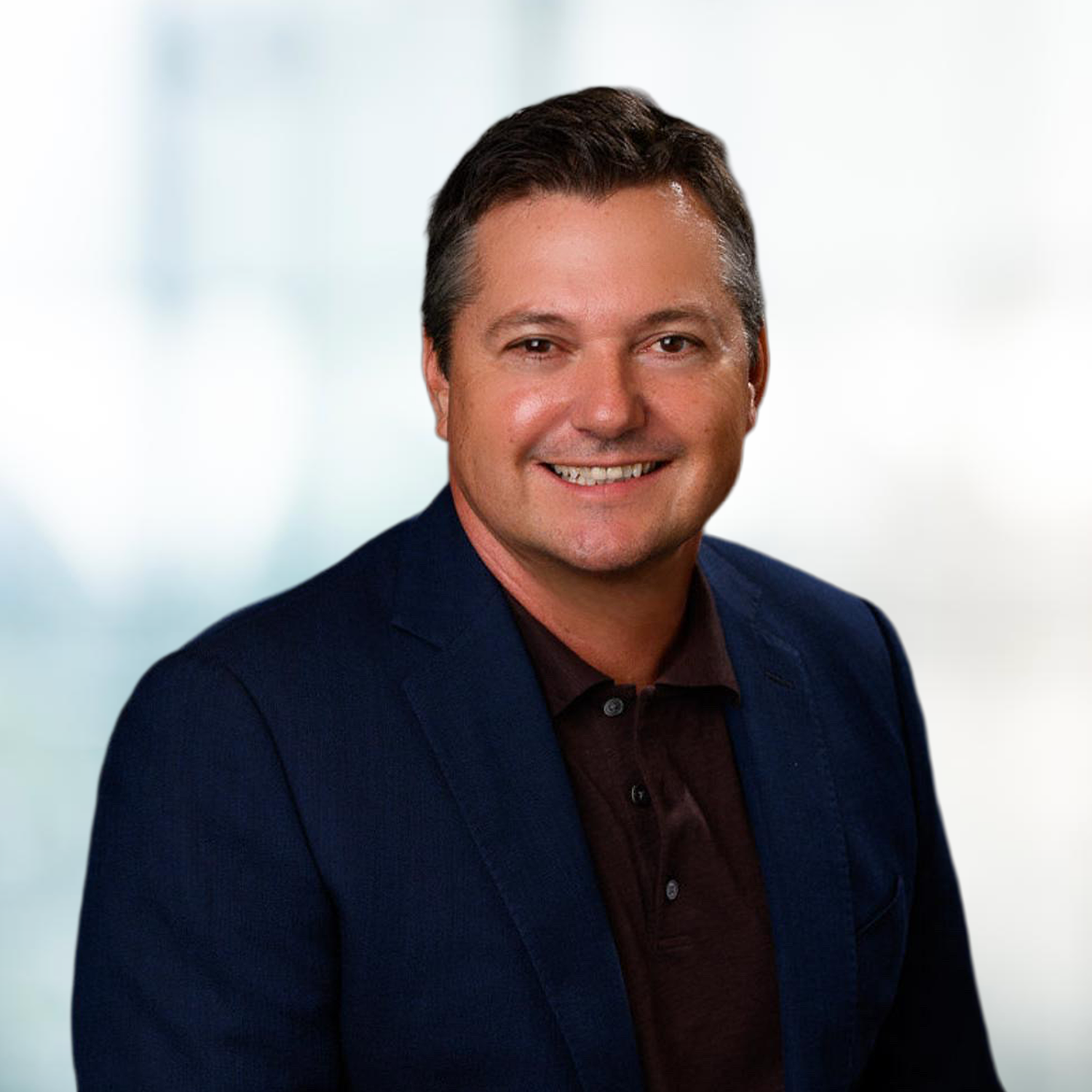 Dan Harrison, President of Sales, against a blurred background