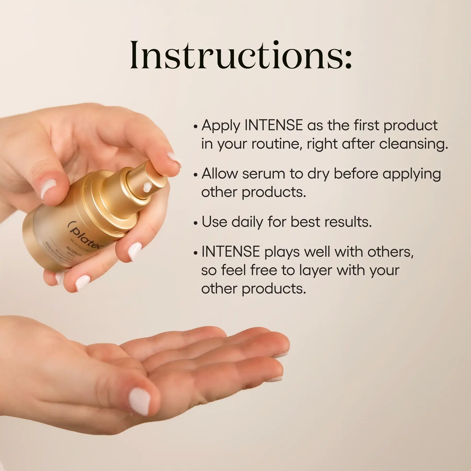 Hand holding ( plated )'s INTENSE Serum bottle with application instructions on a beige background