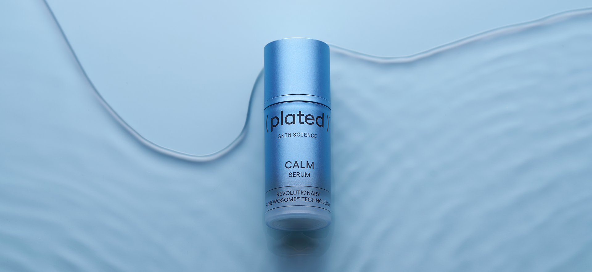 ( plated ) Skin Science CALM Serum bottle on a blue background