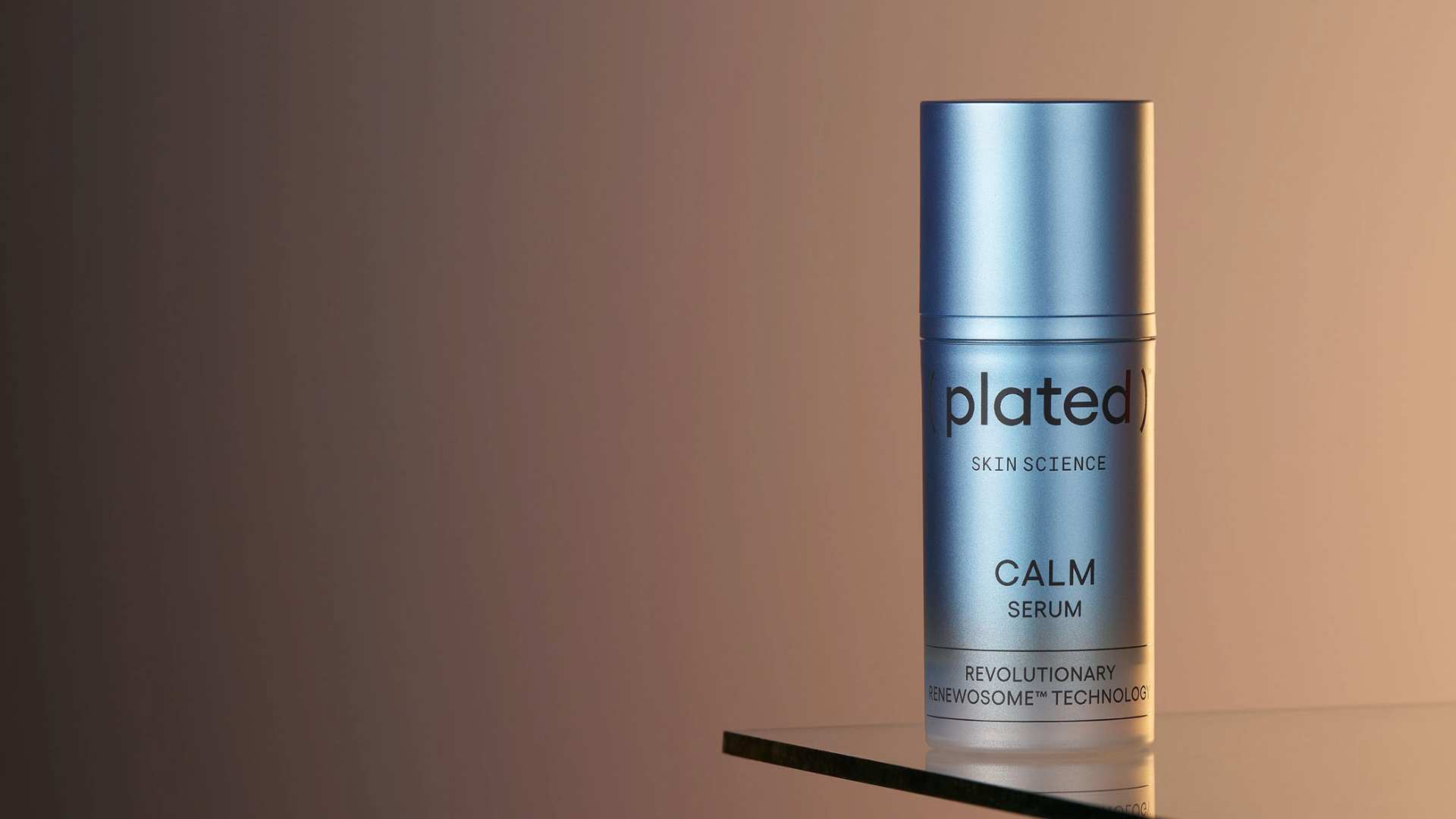 ( plated )® Skin Science CALM Serum bottle on a reflective, glass surface with a gradient background
