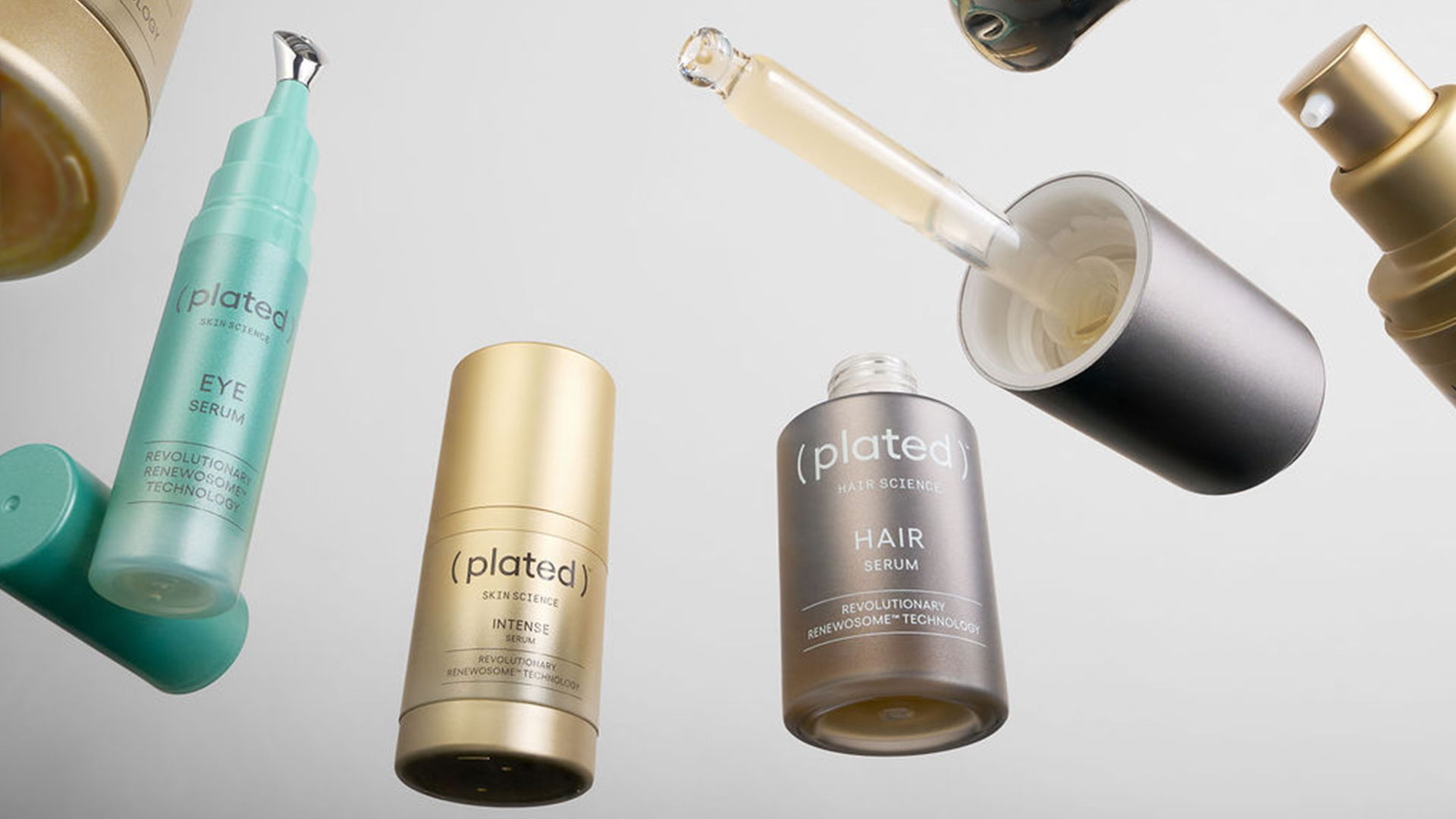 Collection of ( plated ) Skin Science and Hair Science products on a gray background