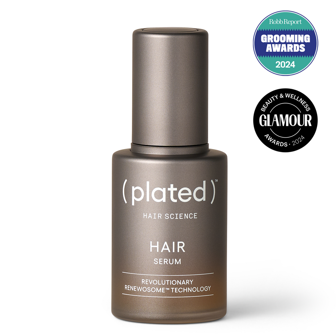 HAIR Serum full-size bottle with 'Robb Report' and 'Glamour' awards  badges on a white background.
