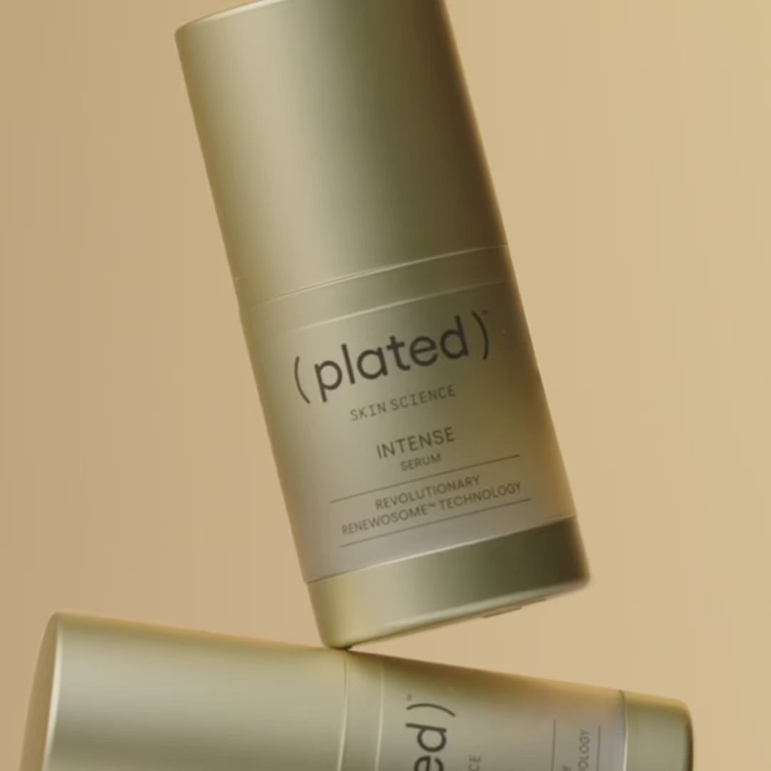 Gold bottles of ( plated ) INTENSE Serum on display and being applied to a model's face and finger.